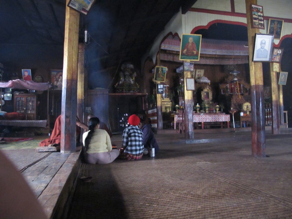 Myanmar trek temple, monk visited by villagers